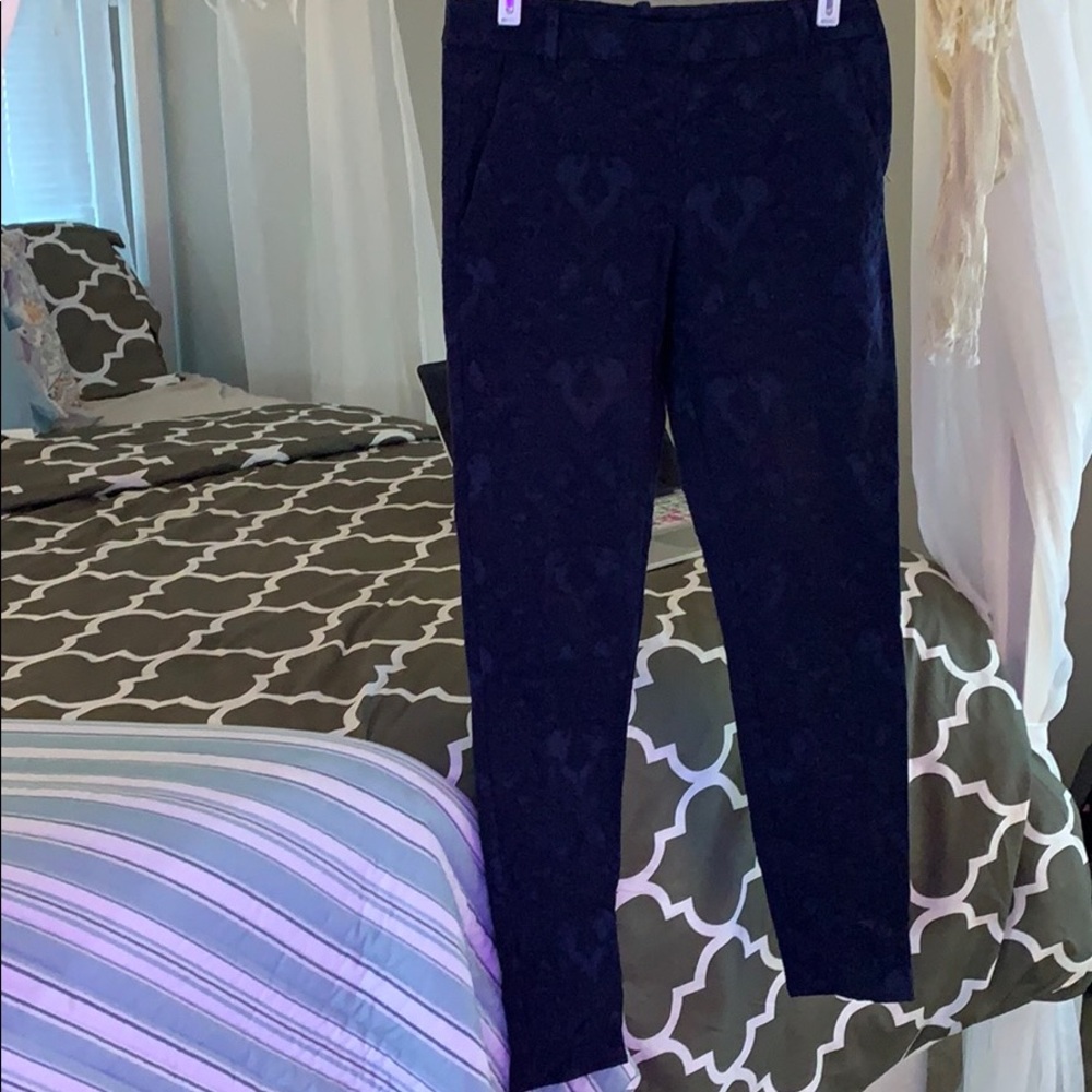 Blue floral fabric trousers.